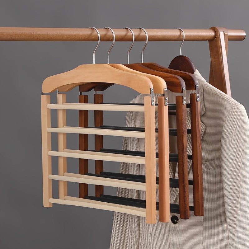 Set of wooden hangers with a rack on a gray background