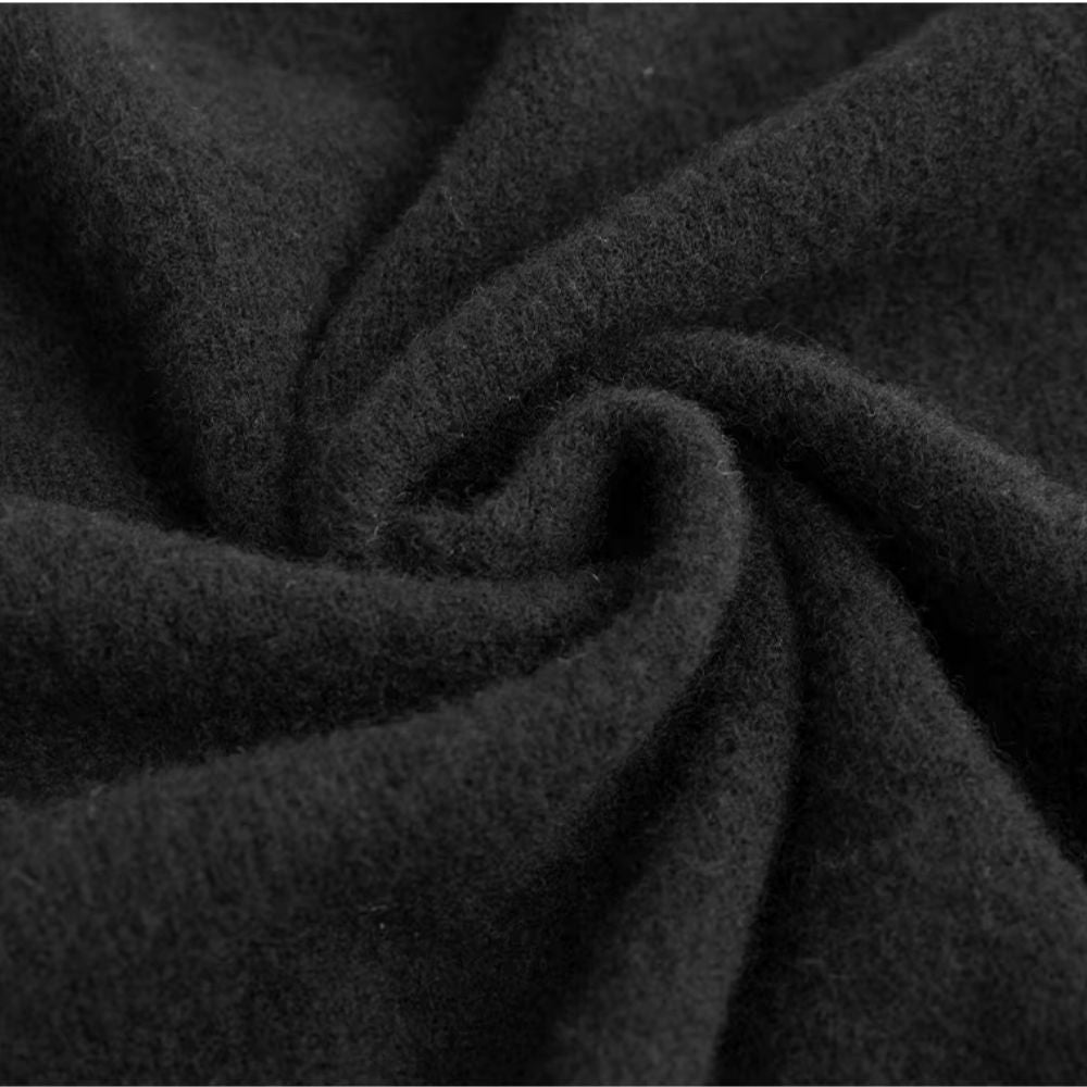 Close-up black wool fabric – Polumi minimalist men’s rollneck sweater premium knitwear