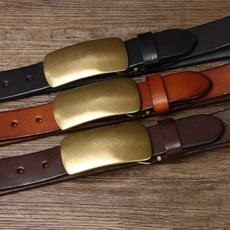 Gianluca Brass Buckle Belt collection – brown, black, and dark brown leather belts with brass buckles arranged on wooden surface by Polumi.