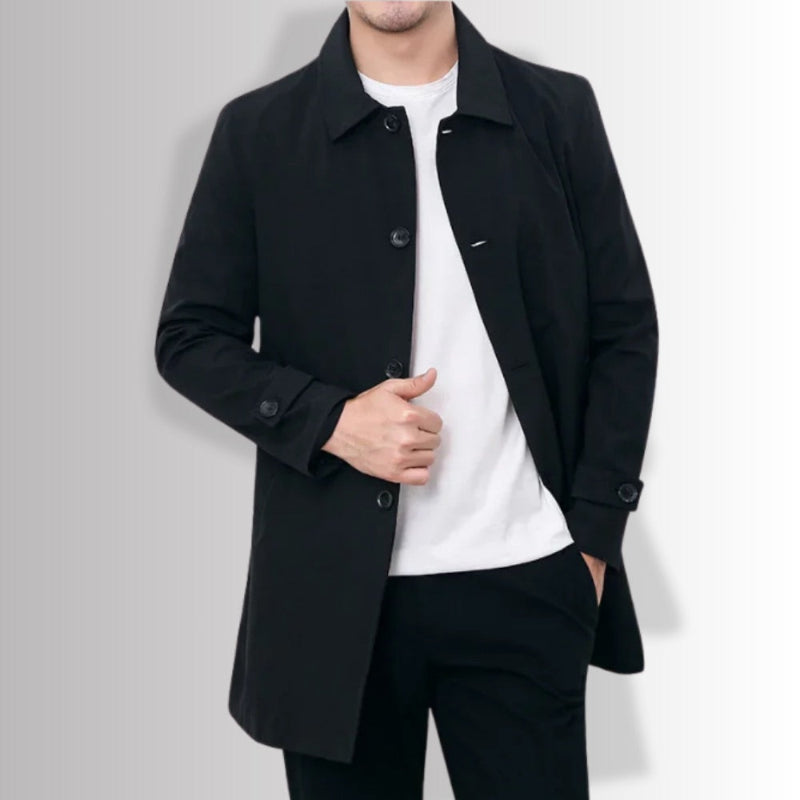 Black Massimo Exclusive Trench Coat closed front view, showcasing minimalist silhouette and sleek finish.