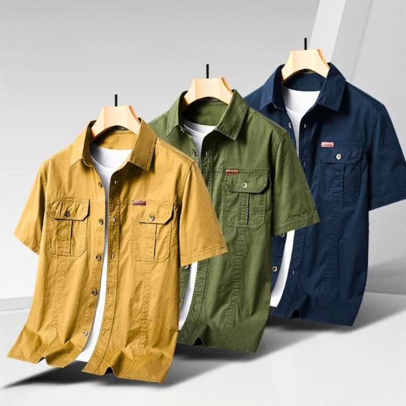 Men’s short sleeve casual shirts in three colors: mustard yellow, green, and navy blue.