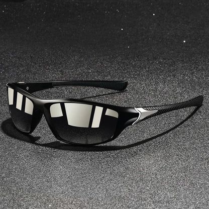 Black sunglasses with reflective lenses on a dark textured surface