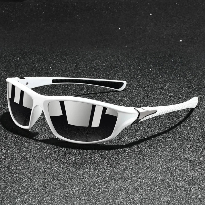 White sunglasses with reflective lenses on a black textured surface
