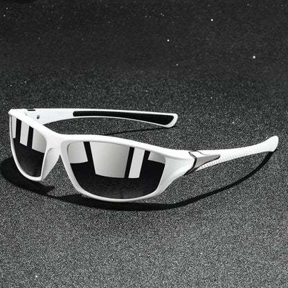 White sunglasses with reflective lenses on a black textured surface