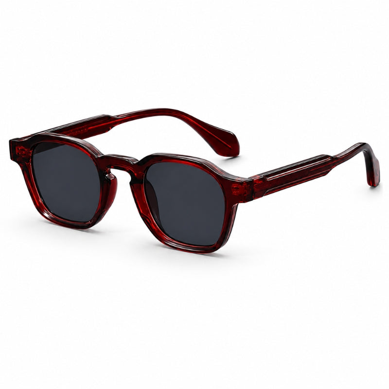 Sunglasses with red frame and dark lenses on a white background