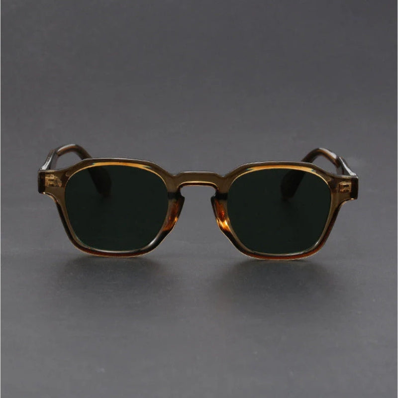 Sunglasses with a tortoiseshell frame on a gray background