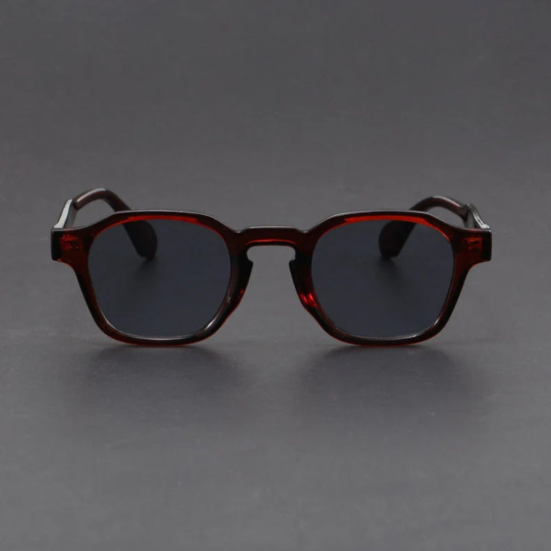 Round sunglasses with tortoiseshell frame on a dark gray background