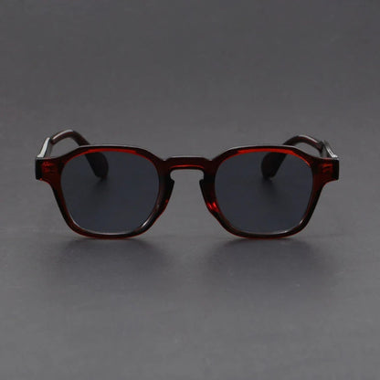 Round sunglasses with tortoiseshell frame on a dark gray background