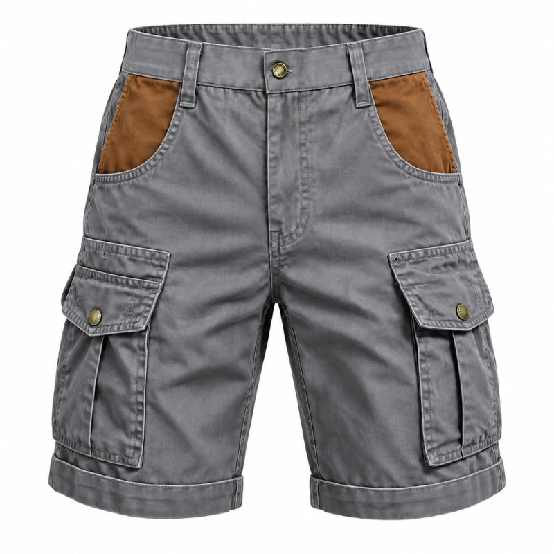 Gray cargo shorts with brown contrast panels on the back pockets and front flap pockets, featuring a button closure and rolled cuffs, shown on a plain white background.