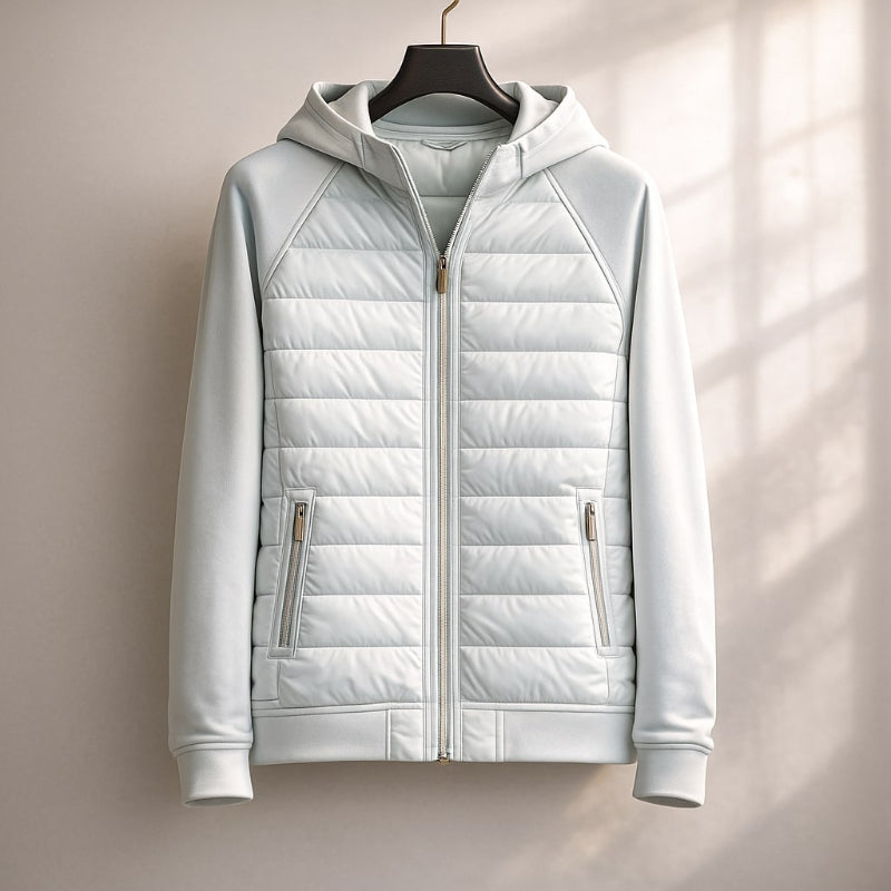 Light gray quilted jacket on a hanger against a neutral background