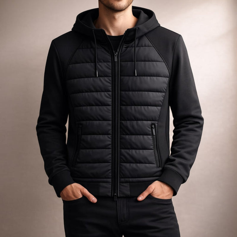 Black puffer jacket worn by a person on a beige background