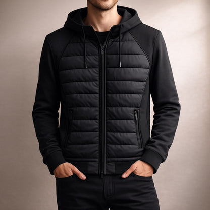 Black puffer jacket worn by a person on a beige background