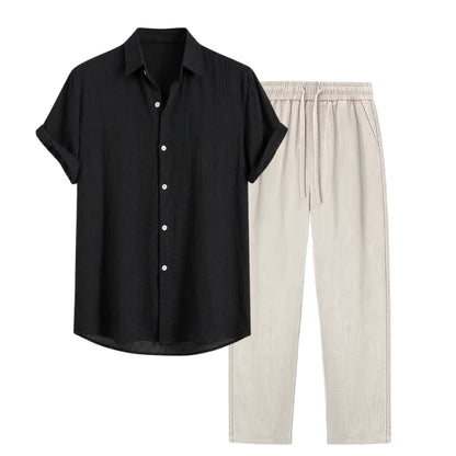 Black short-sleeve shirt and beige pants on a white background