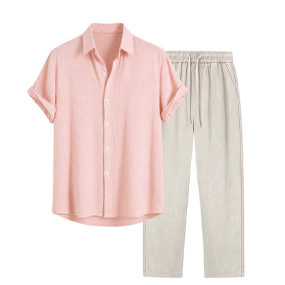 Pink shirt and beige pants on a white background