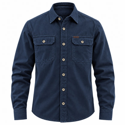 A dark navy blue long-sleeve button-up shirt with two buttoned chest pockets, shown on a plain white background.
