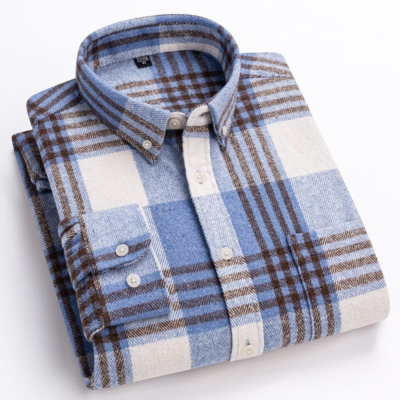 Folded plaid shirt with blue, brown, and white pattern on a light background