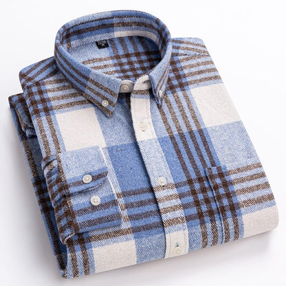 Folded plaid shirt with blue, brown, and white pattern on a light background