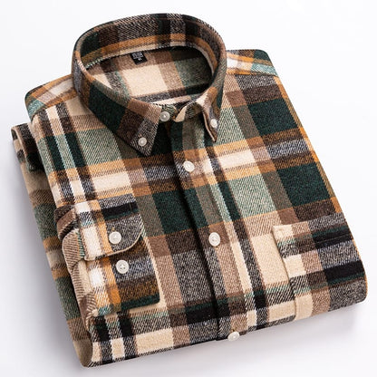 Folded plaid shirt with brown, green, and beige colors on a white background