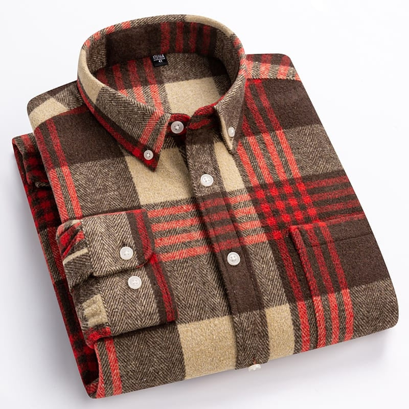 Folded plaid shirt with brown, red, and beige colors on a white background