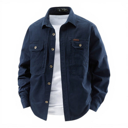 Navy blue jacket with white shirt underneath on a white background
