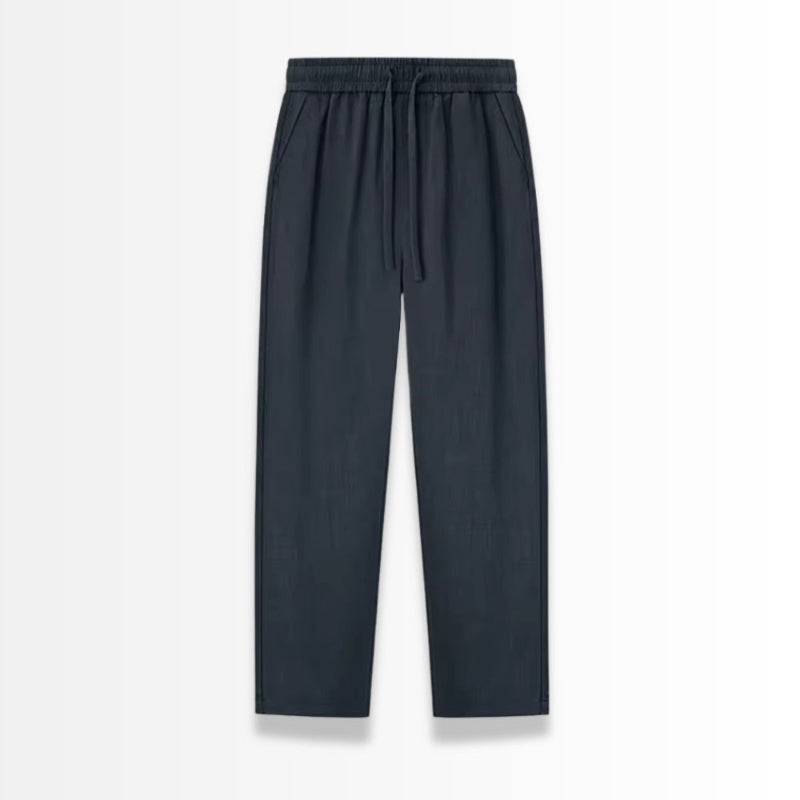 Navy linen pants on a light gray background