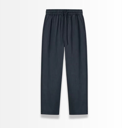 Navy linen pants on a light gray background