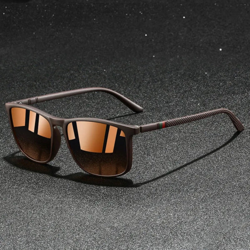 Sunglasses with brown reflective lenses on a dark textured background