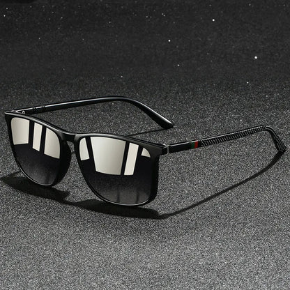 Black sunglasses with reflective lenses on a dark textured background