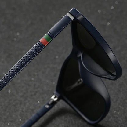 Black sunglasses with a textured blue strap on a dark background