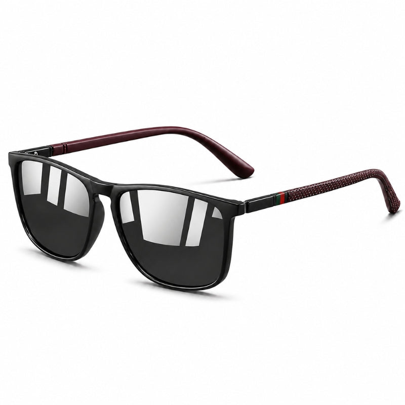 Sunglasses with black lenses and red and green accents on a white background