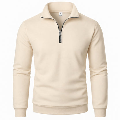 A men's long-sleeve quarter-zip sweatshirt in cream beige, featuring a mock neck collar with black piping and a black zipper pull, shown on a plain white background.
