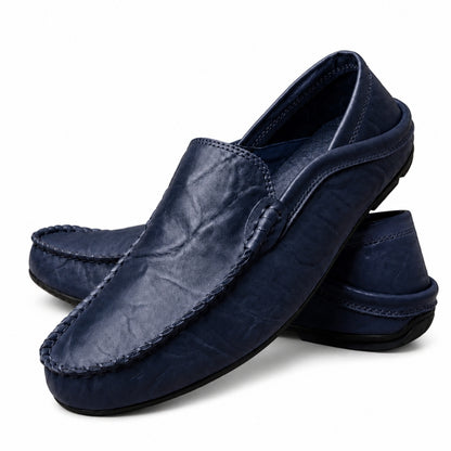 Pair of navy blue loafers on a white background