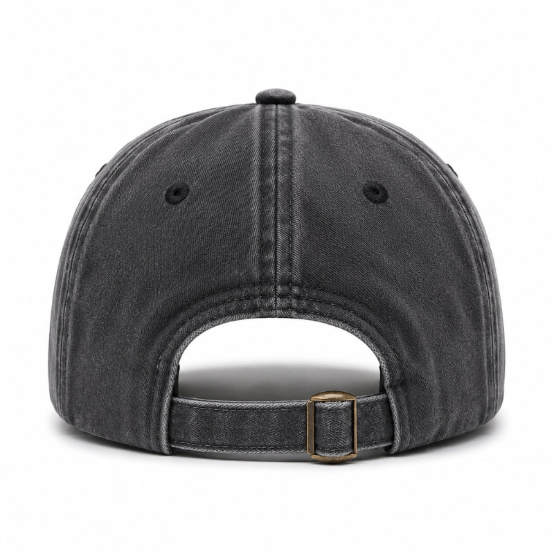 Black denim cap with a brown leather strap on a white background