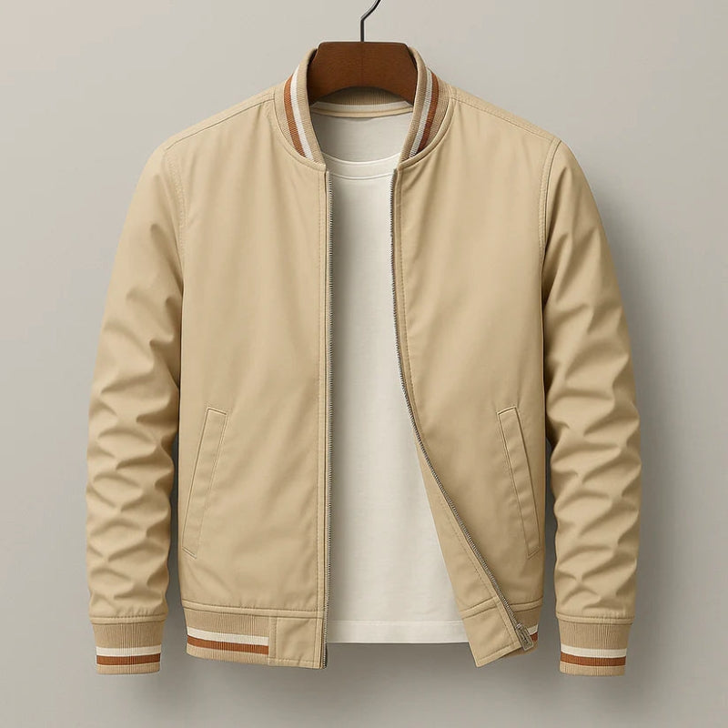 Beige bomber jacket on a hanger against a plain background