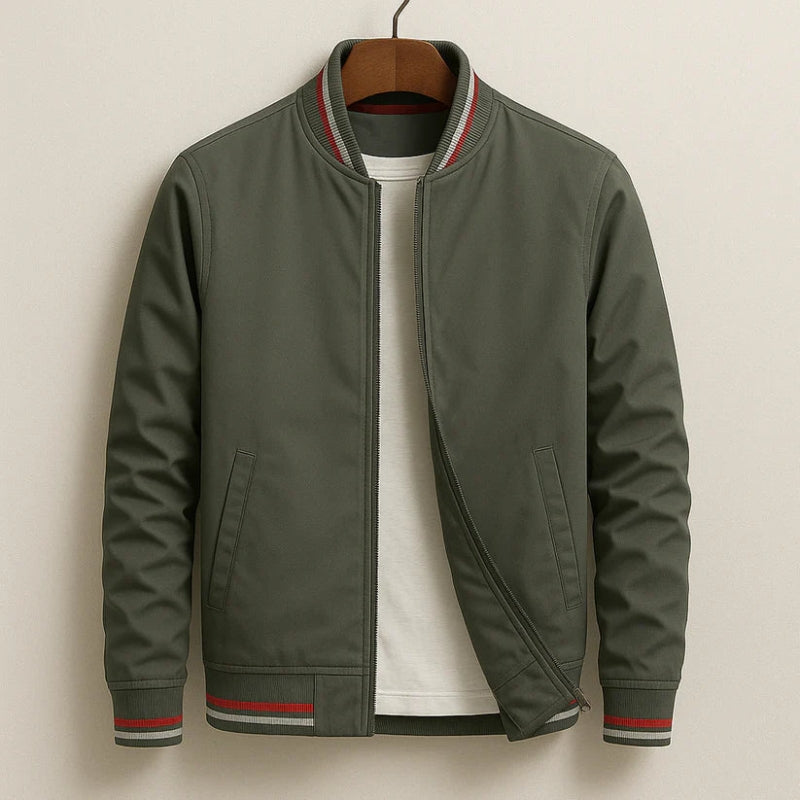 Green jacket with red and white trim on a beige background