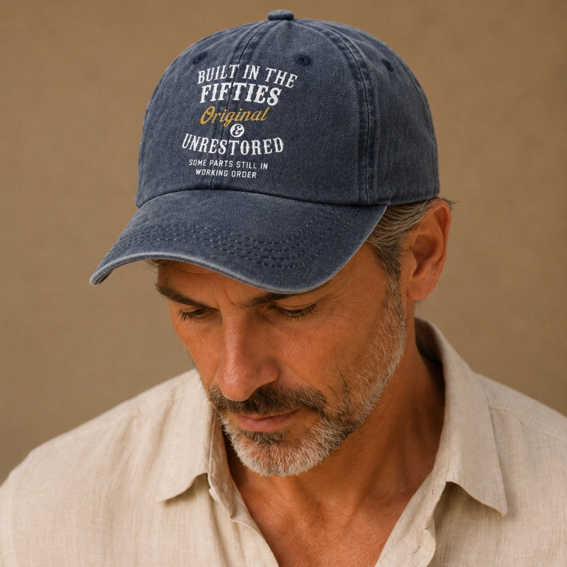 Man wearing a blue cap with text on a beige background