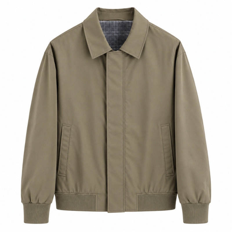 A light brown utility jacket with a pointed collar, front zipper, and ribbed cuffs and hem, shown against a plain white background.