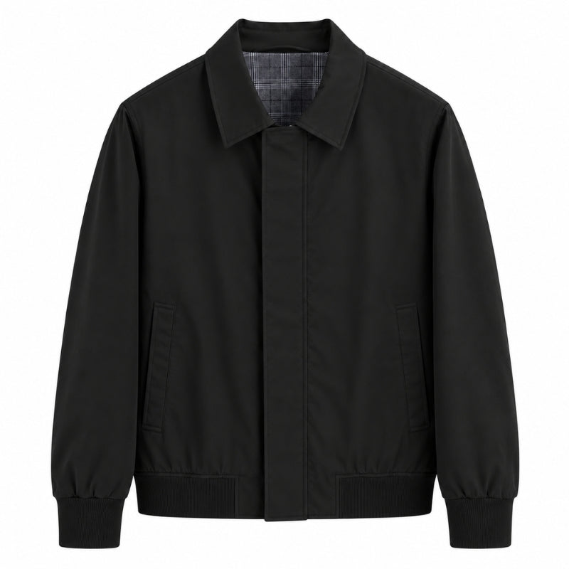 A black utility-style jacket with a pointed collar, front closure, and two front pockets, shown on a plain white background.