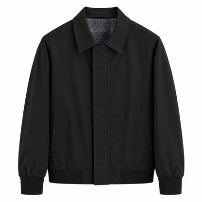 A black utility-style jacket with a pointed collar, front closure, and two front pockets, shown on a plain white background.