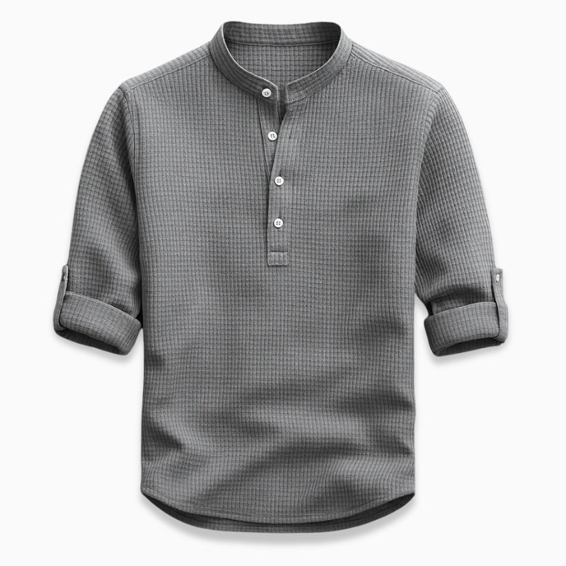 Gray checkered shirt with rolled-up sleeves on a white background