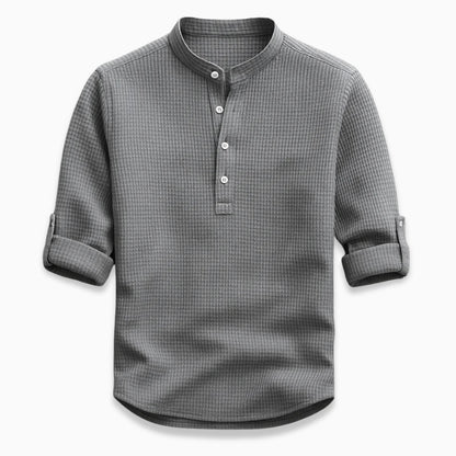 Gray checkered shirt with rolled-up sleeves on a white background