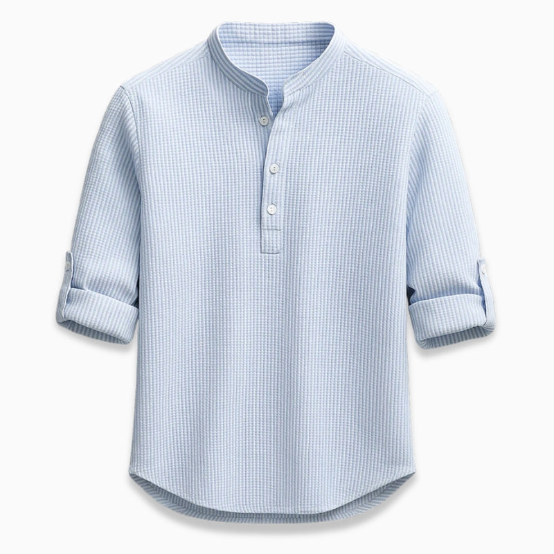 Blue checkered shirt with rolled-up sleeves on a white background