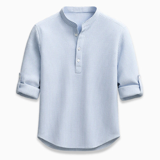 Blue checkered shirt with rolled-up sleeves on a white background