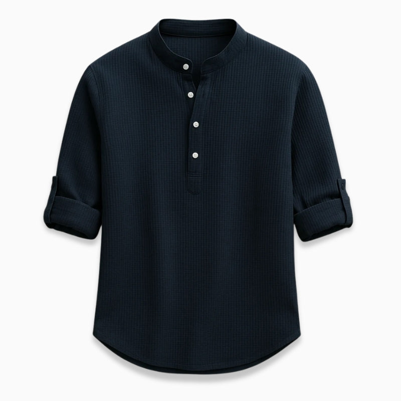 Navy long-sleeve shirt with button details on a white background