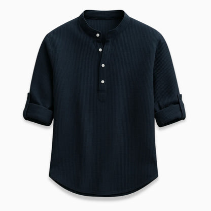 Navy long-sleeve shirt with button details on a white background