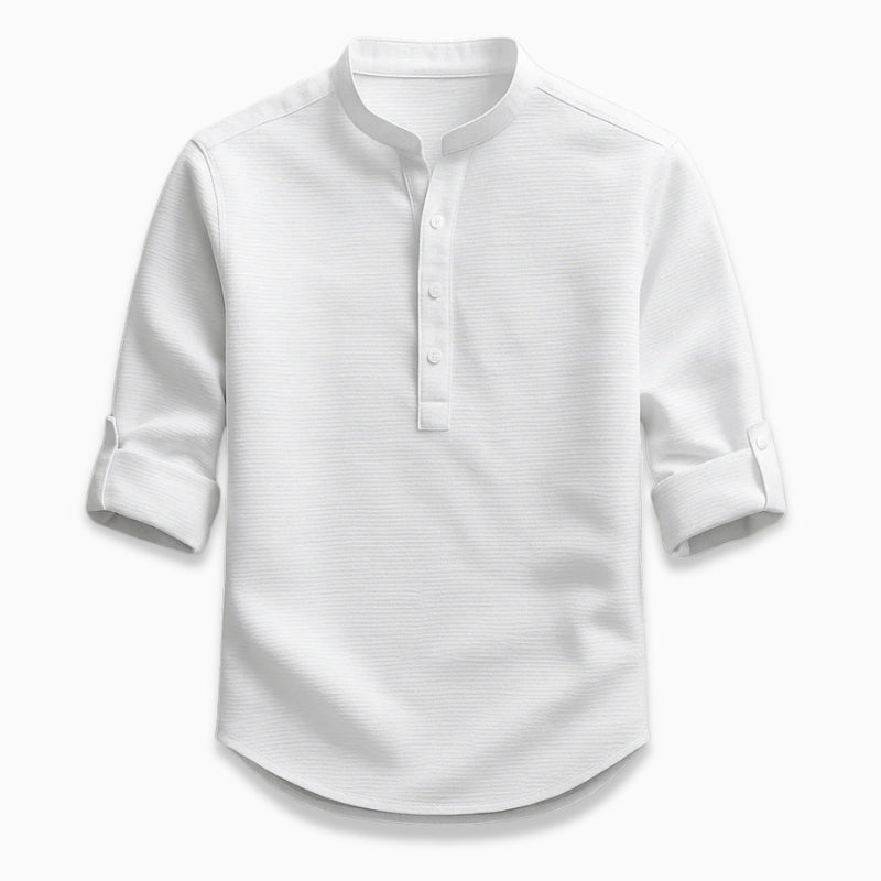 White shirt with rolled-up sleeves on a light gray background