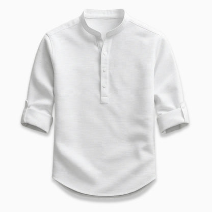 White shirt with rolled-up sleeves on a light gray background