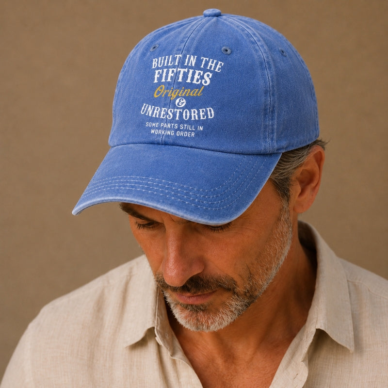 Man wearing a blue cap with text on a beige background