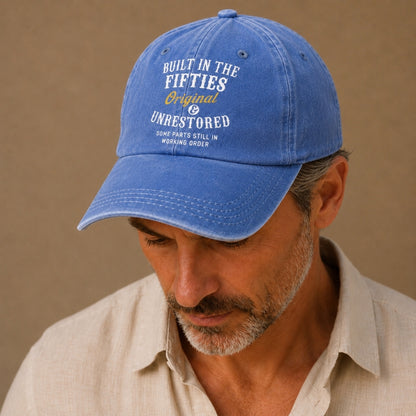 Man wearing a blue cap with text on a beige background