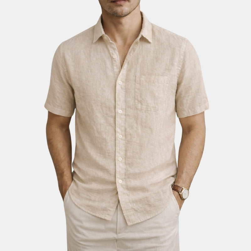 Man wearing a khaki linen shirt and pants on a white background